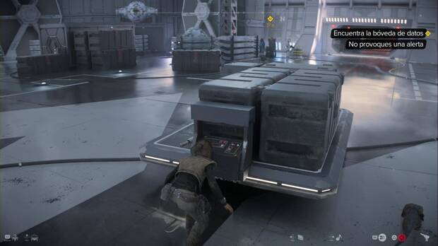 Star Wars Outlaws - Falsa bandera: Kay avanza por el hangar cubriéndose con una aerovagoneta
