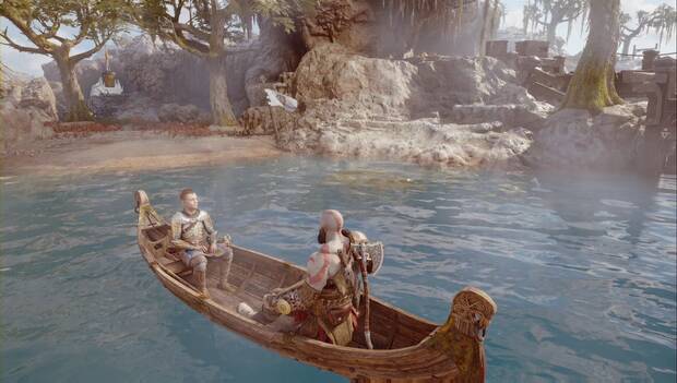 God of War: Ragnarok - En busca de Tyr: Kratos y Atreus sentados en una barca en el agua, con una playa en la que se puede desembarcar frente a ellos