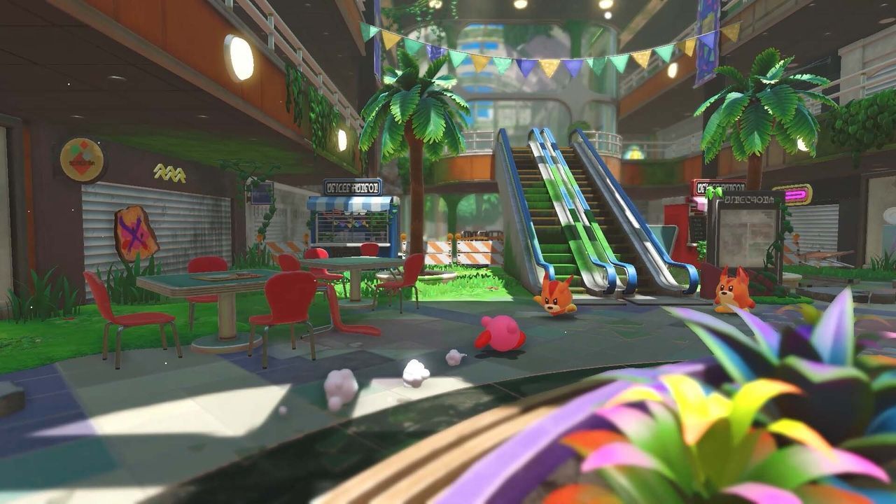 Captura de la jugabilidad de Kirby y la tierra olvidada en un nivel que se desarrolla dentro de un centro comercial