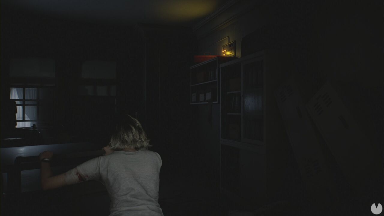 Resident Evil Requiem - Patient Center, Grace moves the cart towards the toolbox in the corner of the Staff Room