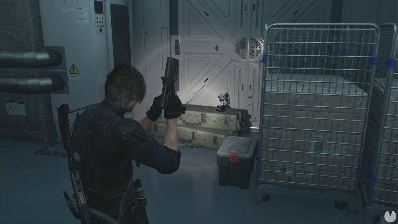 Resident Evil Requiem - ARK, Mr. Raccoon in ARK's initial hallway, just before the first flight of stairs leading down from the Staff Room hallway