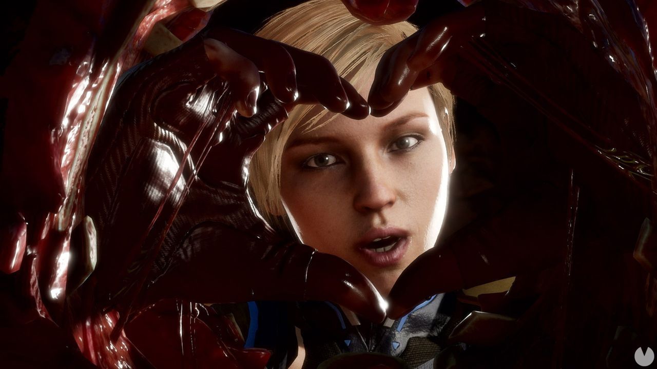 Cassie Cage posing through a heart-shaped wound during a Mortal Kombat 11 Fatality